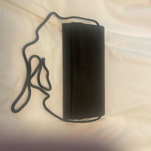 Small black evening bag with braided ribbon strap